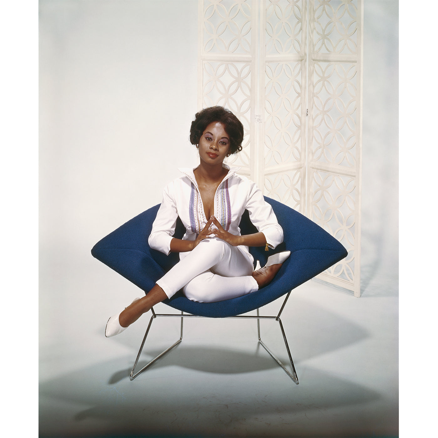 "Young Woman Sitting on Armchair" from Getty Images